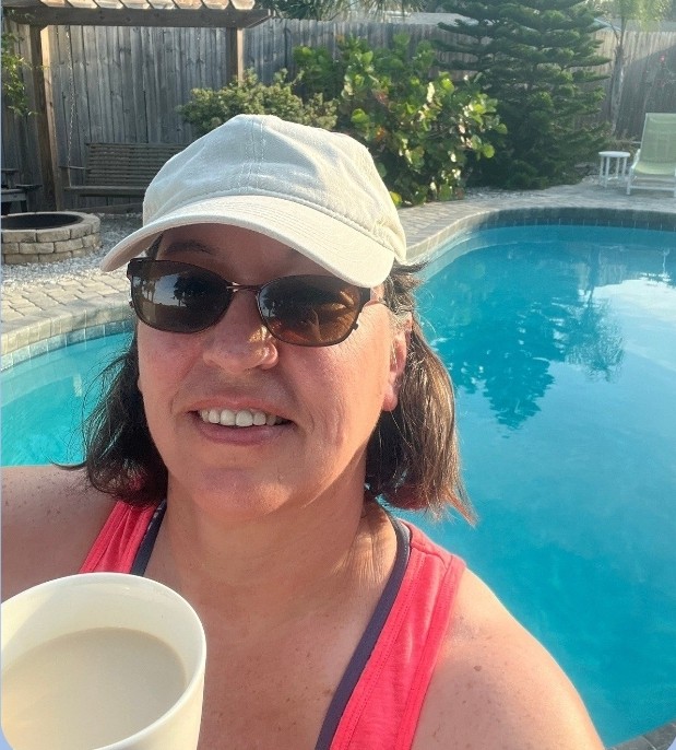 image of a woman in front of a pool