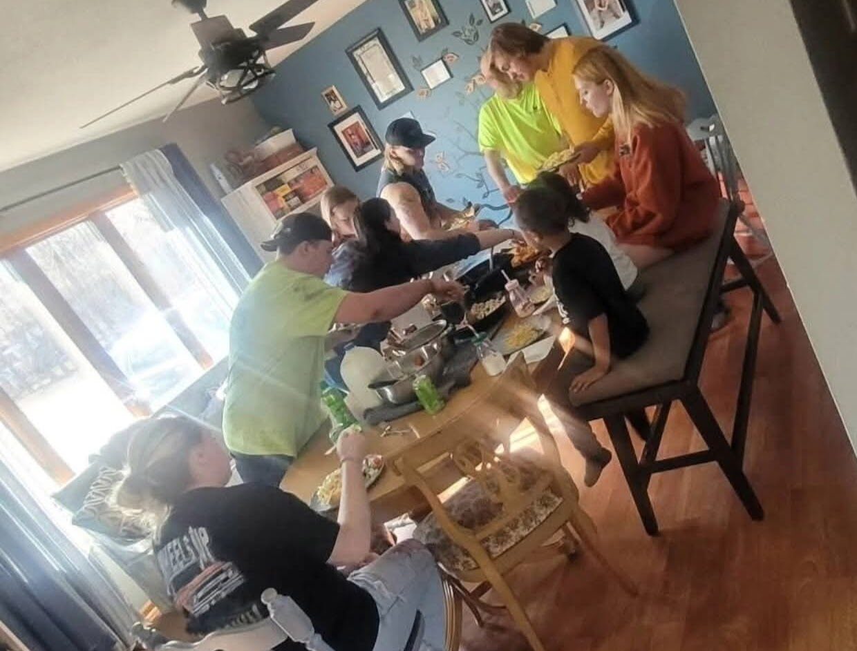 image of a family preparing the table for a family meal